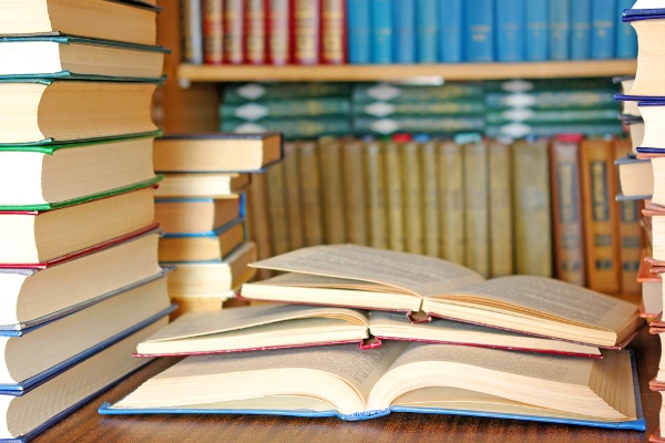 books_open_on_desk_in_library_60121213-2 books_open_on_desk_in_library_60121213-2