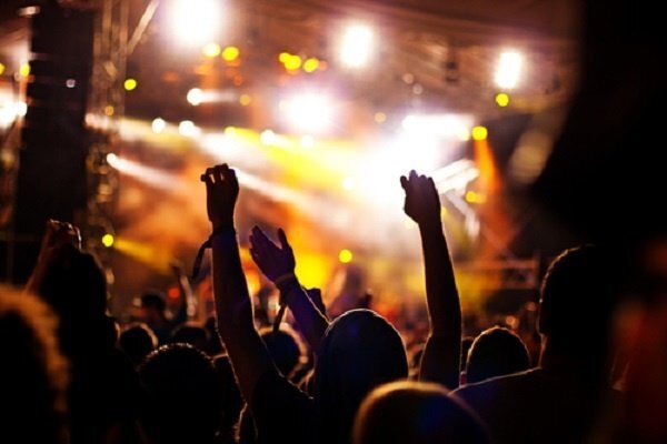 band_audience_waving_hands_amber_glow band_audience_waving_hands_amber_glow